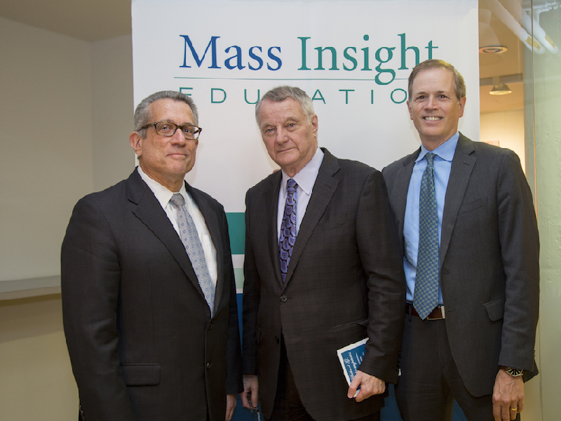 Michael Contompasis and colleagues in front of Mass Insight Education pop-up banner.
